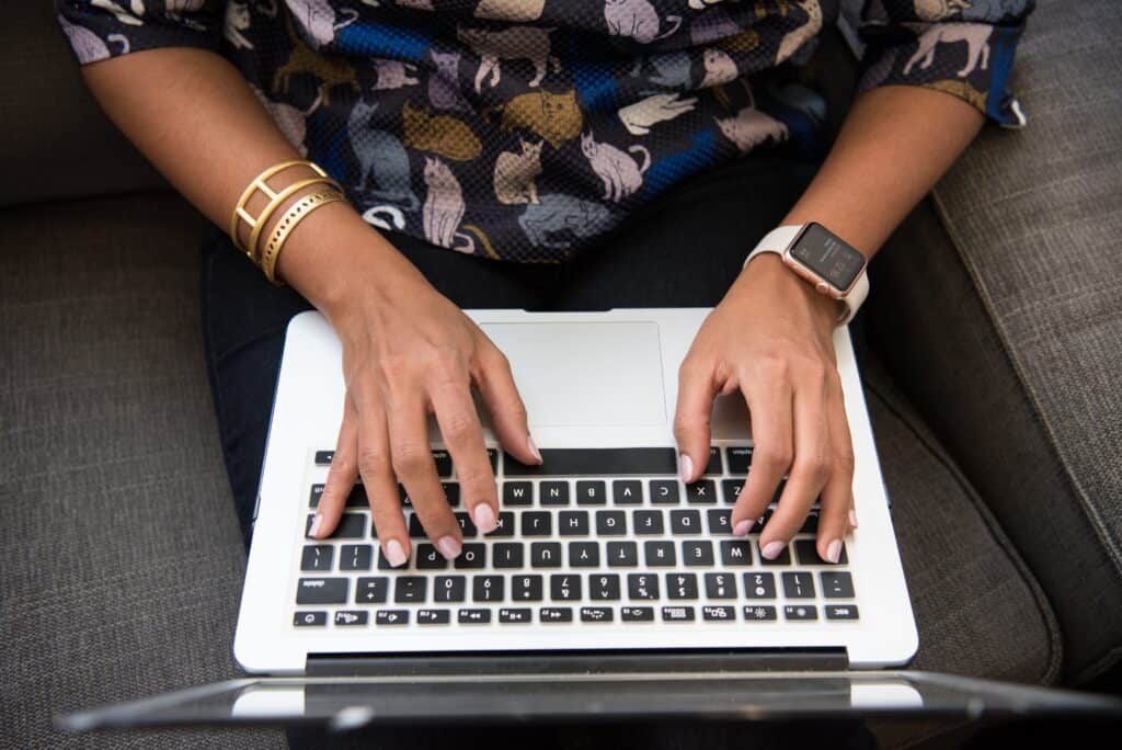 woman typing on laptop