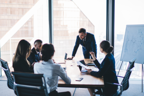 business partners in corporate suits having a meeting