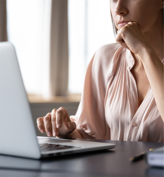 business woman clicking her laptop
