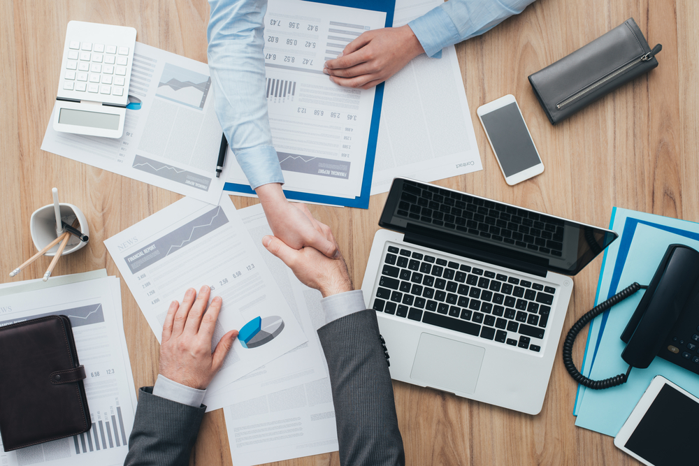 business people working shakes hands